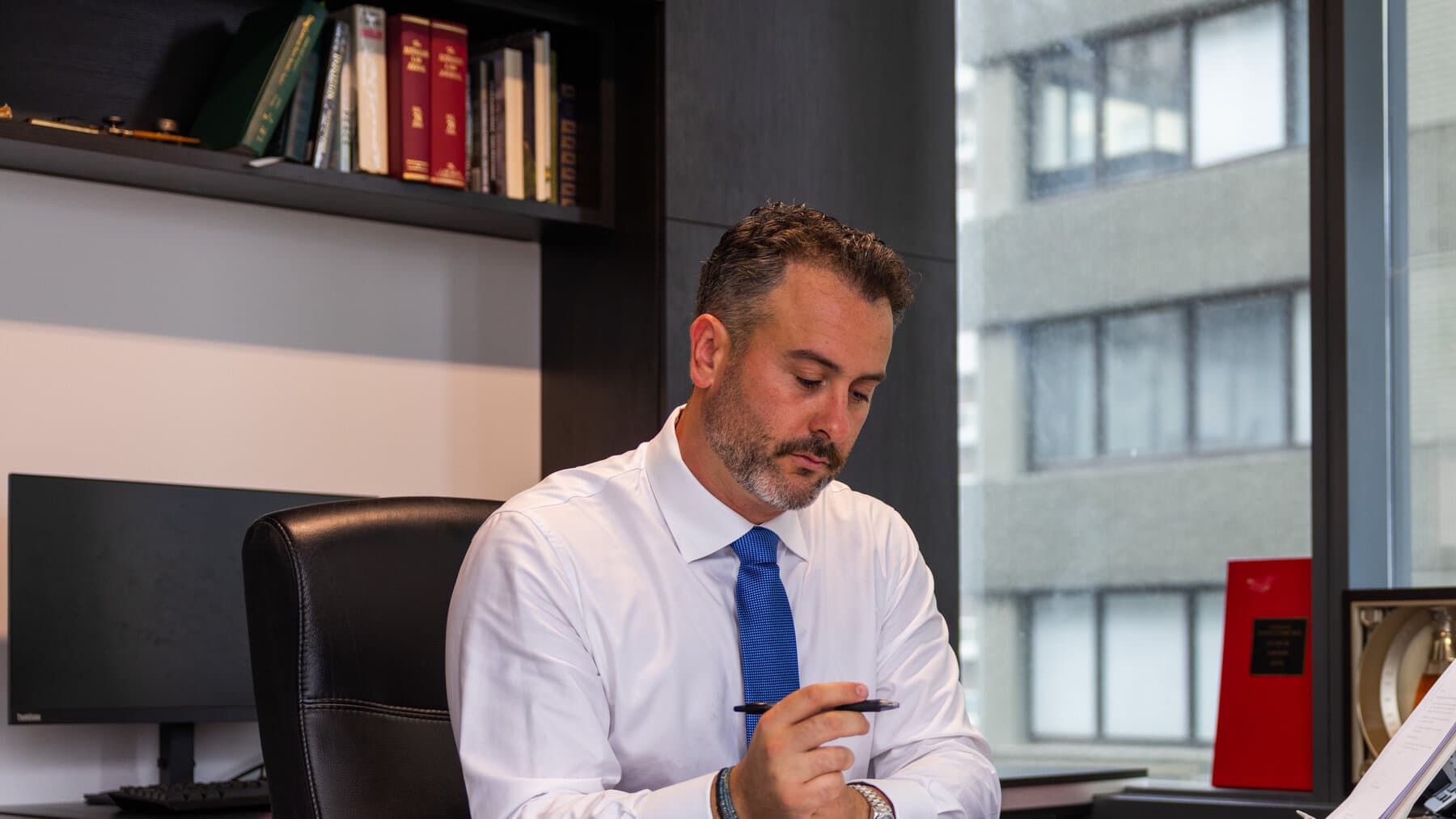 Rick Korn at desk reviewing case files